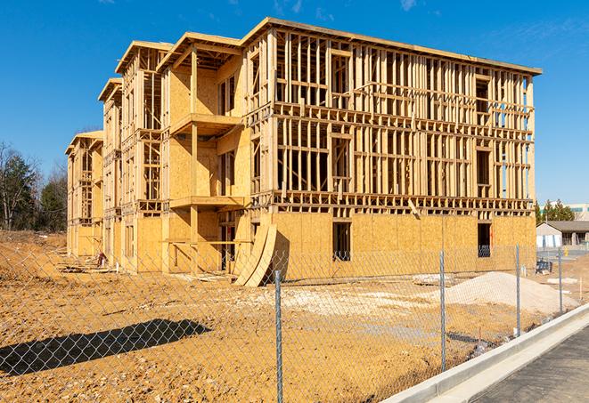 a snapshot of temporary chain link fences protecting a large construction project from unauthorized access in Thiensville